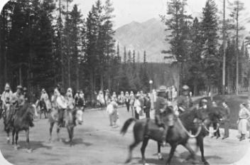 Horseback parade of Mounties and aboriginals, Banff Indian Days, Banff, AB, 1929