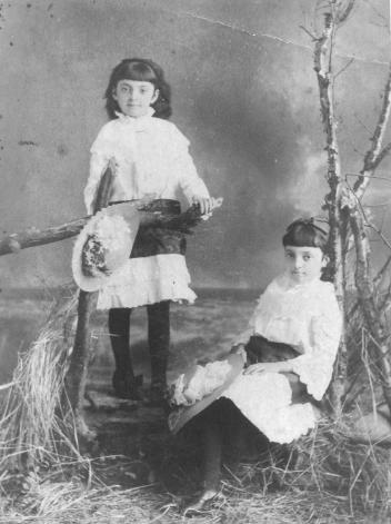 Two young girls in matching white dresses, St. John, NB, about 1878