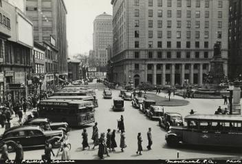 Cars and buses on Phillip's Place, next to Phillips Square, Montreal, QC, ca. 1935