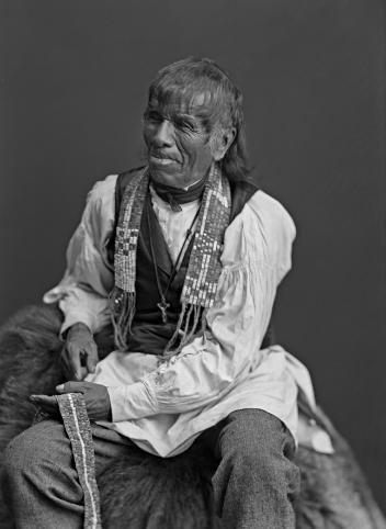 The Onondaga chief Isaac Hill Kaweneseronton of the Six Nations Confederacy with a wampum in his hand and another around his neck, Montreal, QC, 1870