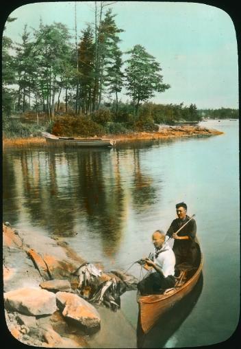 Men in canoe with fish, Honey Harbour, Georgian Bay, ON, about 1935