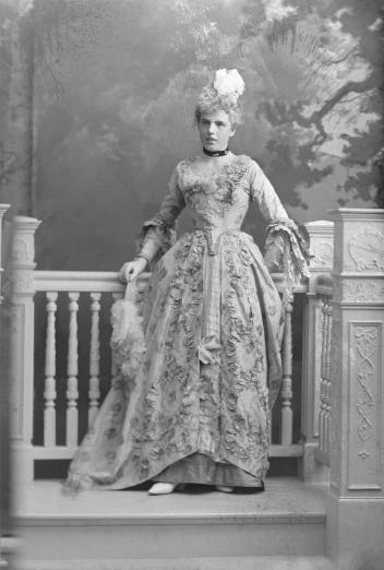 Miss Maud Terroux as the "Baronne de Beaumouchel," costumed for Chateau de Ramezay Ball, Montreal, QC, 1898