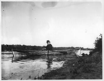 Man in rowboat, St. Francis River, Drummondville, QC, about 1895