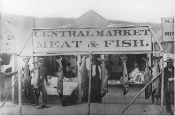 Fish market showing 50 lb salmon, Dawson, YT, 1898